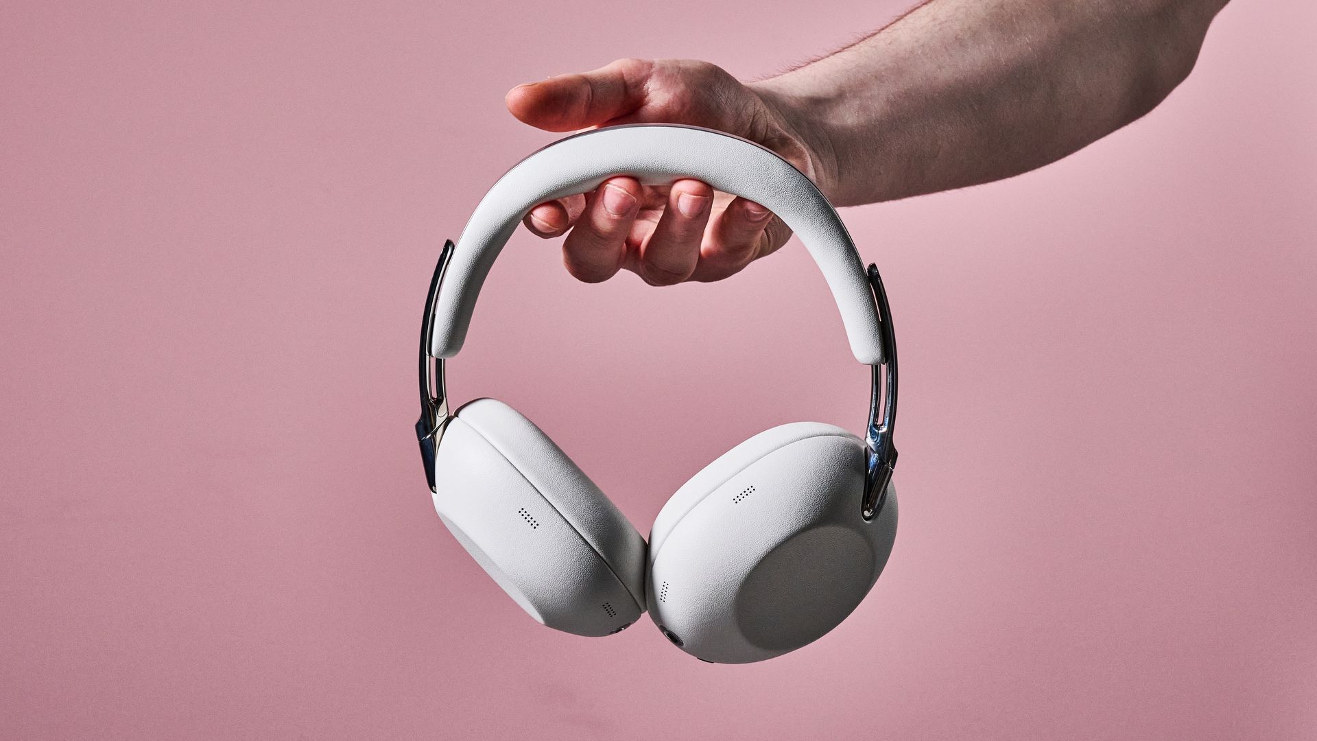 Man holding the Sony 1000X The Collexion headphones