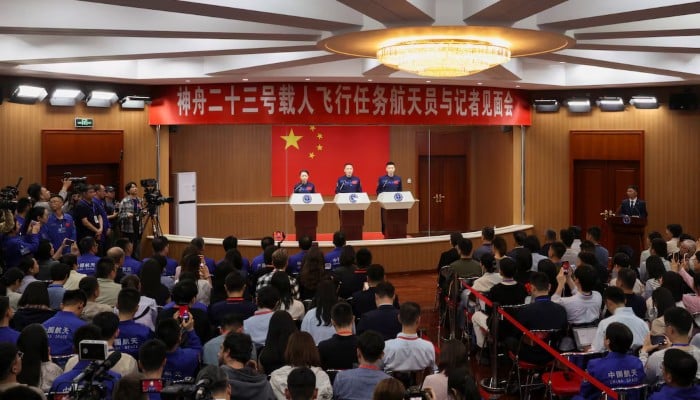 Astronauts Zhu Yangzhu, Zhang Zhiyuan and Lai Ka-ying, who is the first astronaut from Hong Kong, attend a press conference before the Shenzhou-23 space flight mission to China's Tiangong space station at the Jiuquan Satellite Launch Centre, near Jiuquan, Gansu Province, China, May 20, 2026.