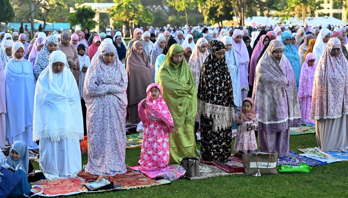 11. Muslim worshipers pray for Eid ul Adha, or the Feast of Sacrifice, in Denpasar on the Indonesian resort island of Bali on May 27, 2026. — AFP