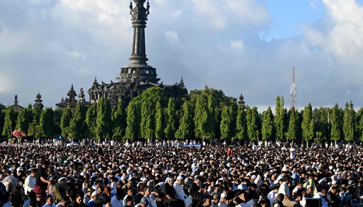 Muslim worshipers pray for Eid ul Adha, or the Feast of Sacrifice, in Denpasar on the Indonesian resort island of Bali on May 27, 2026. — AFP