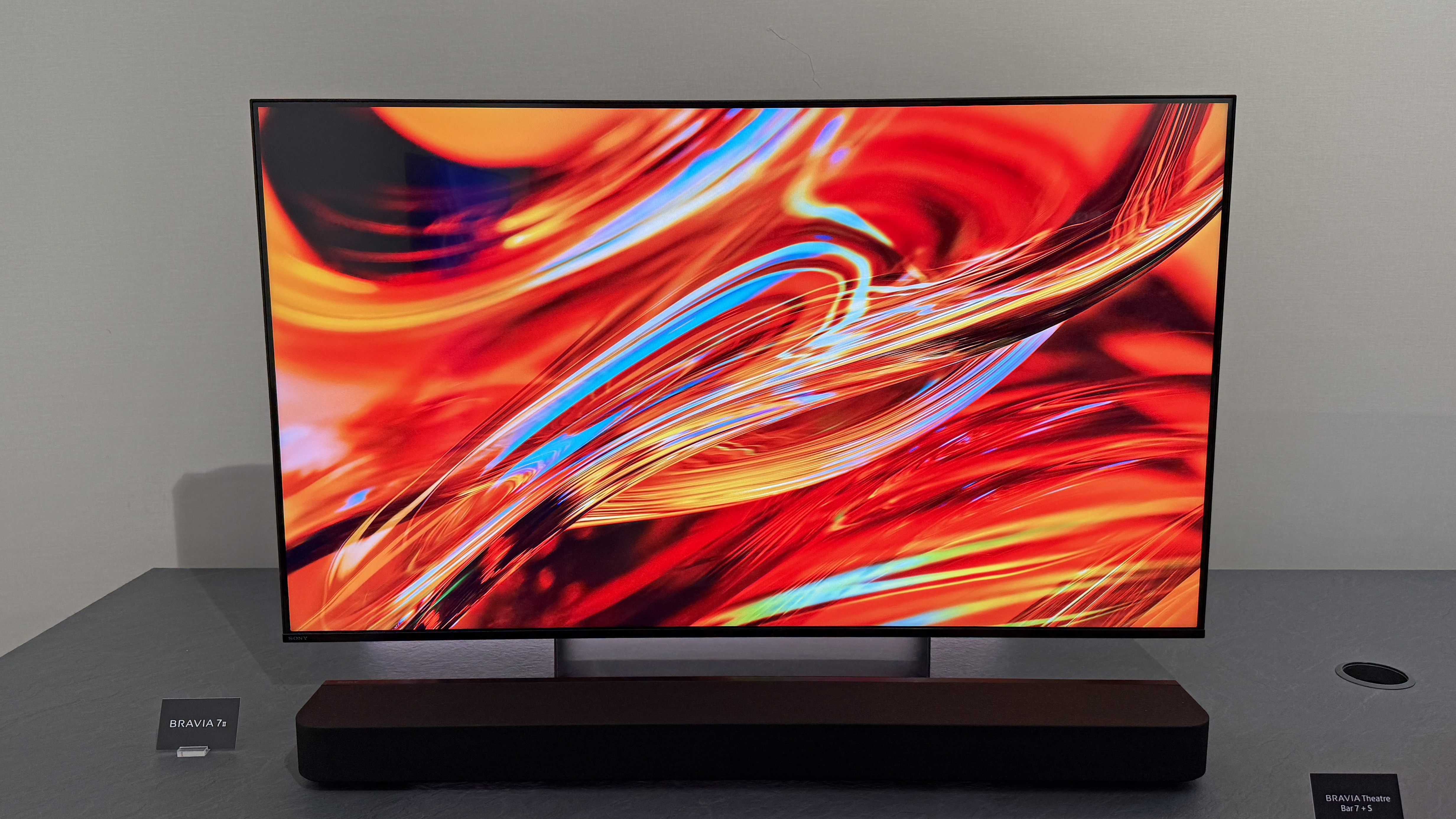 The Sony Bravia 7 II TV displays a colorful red swirl of light