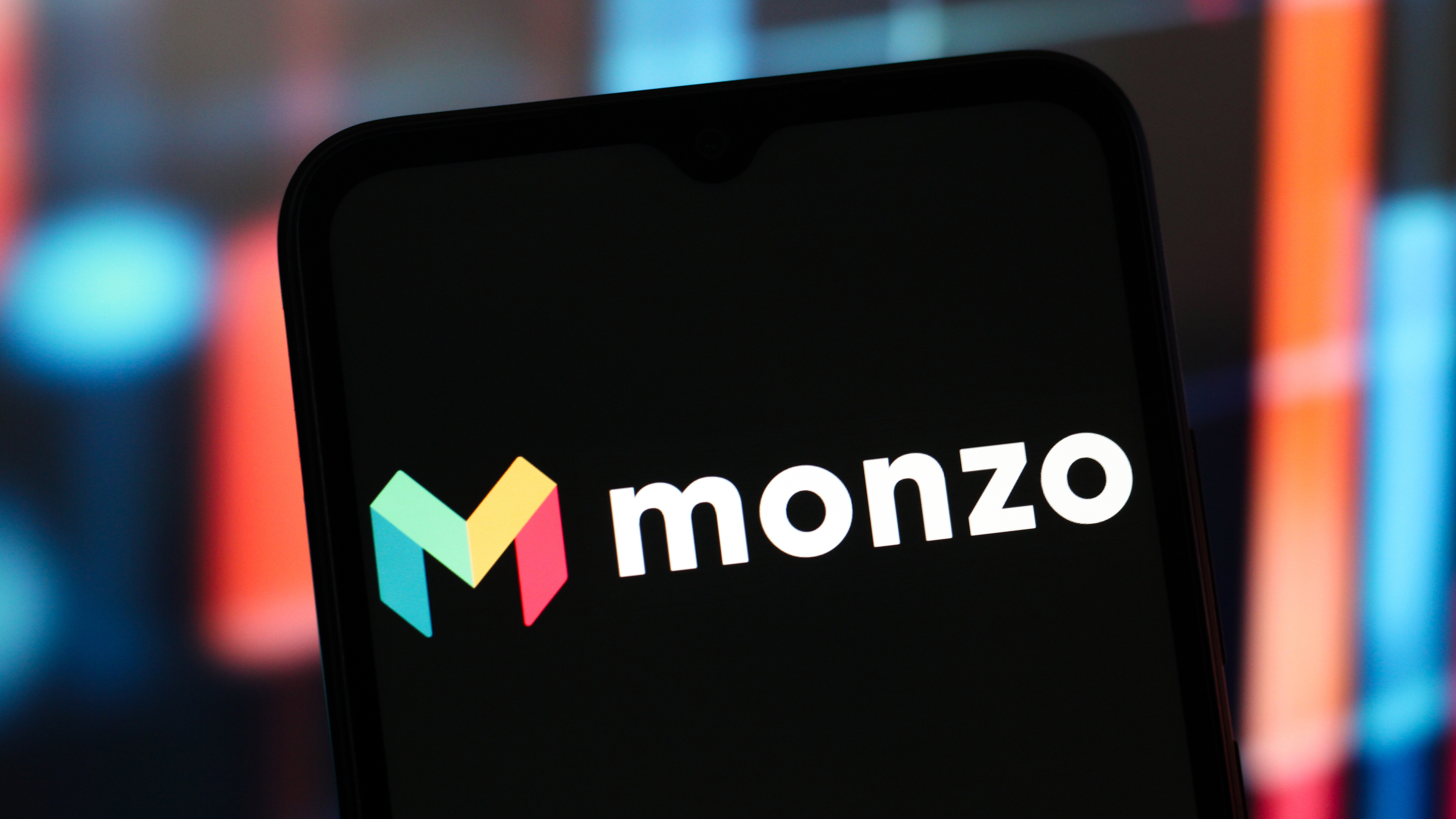 A phone with the Monzo logo