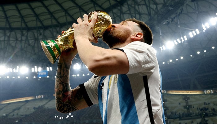 Argentina's Lionel Messi kisses the trophy as he celebrates winning the World Cup, FIFA World Cup Qatar 2022 - Final - Argentina v France - Lusail Stadium, Lusail, Qatar - December 18, 2022. — Reuters