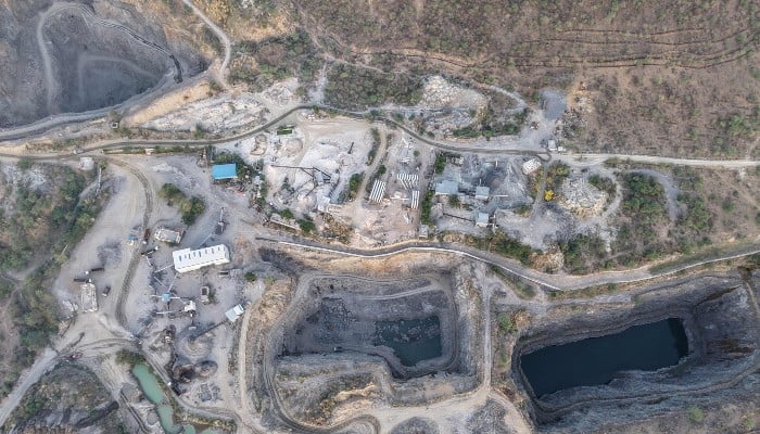 This aerial photo, taken on May 18, 2026, shows an open quarry in the Aravalli mountain range in the Rajasthan town of Neem ka Thana. — AFP