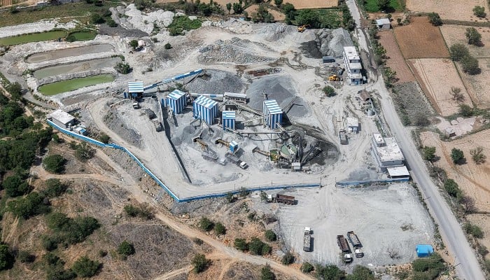 This aerial photo taken on May 19, 2026 shows a stone crushing plant near a quarry in the Aravalli mountain range in the Rajasthan city of Neem ka Thana. — AFP