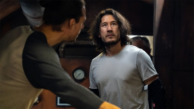 Markiplier in the Iron Lung, with another man in front of him showing him something