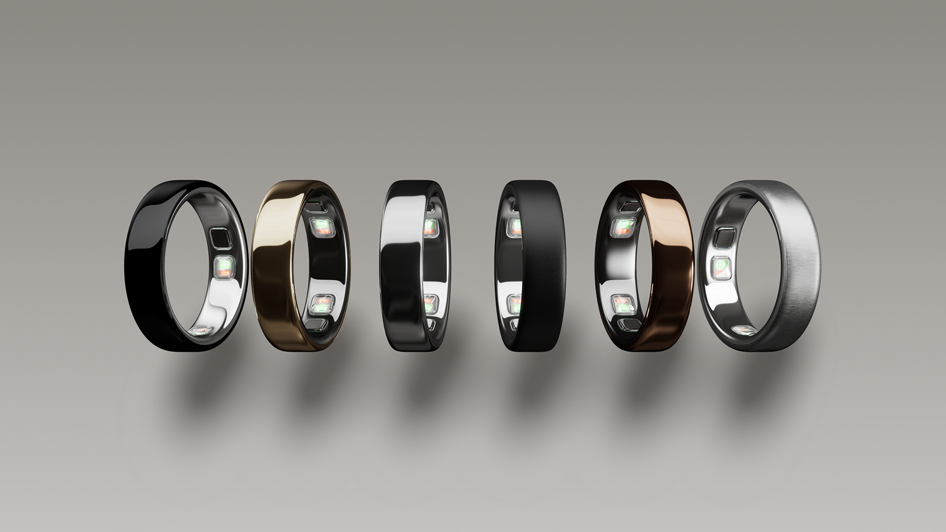 Six Oura Ring 5s lined up side by side showing the difference in finish