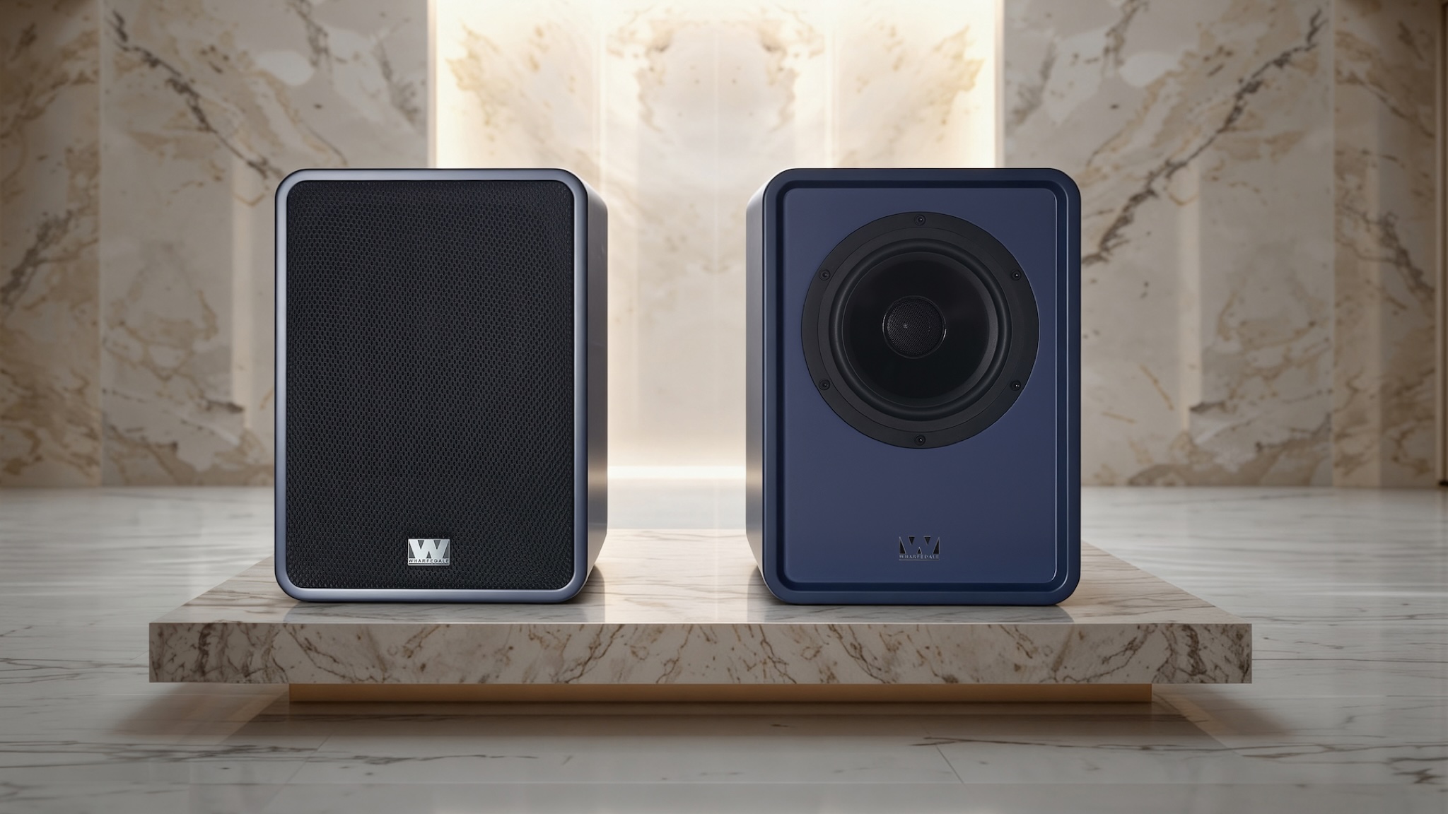 Wharfedale Denton 1S speakers in blue on a sort of marble plinth