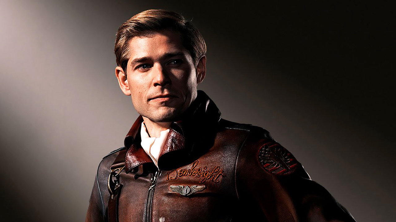 A press shot of Bombsight smiling and looking to the side of the camera in Vought Rising
