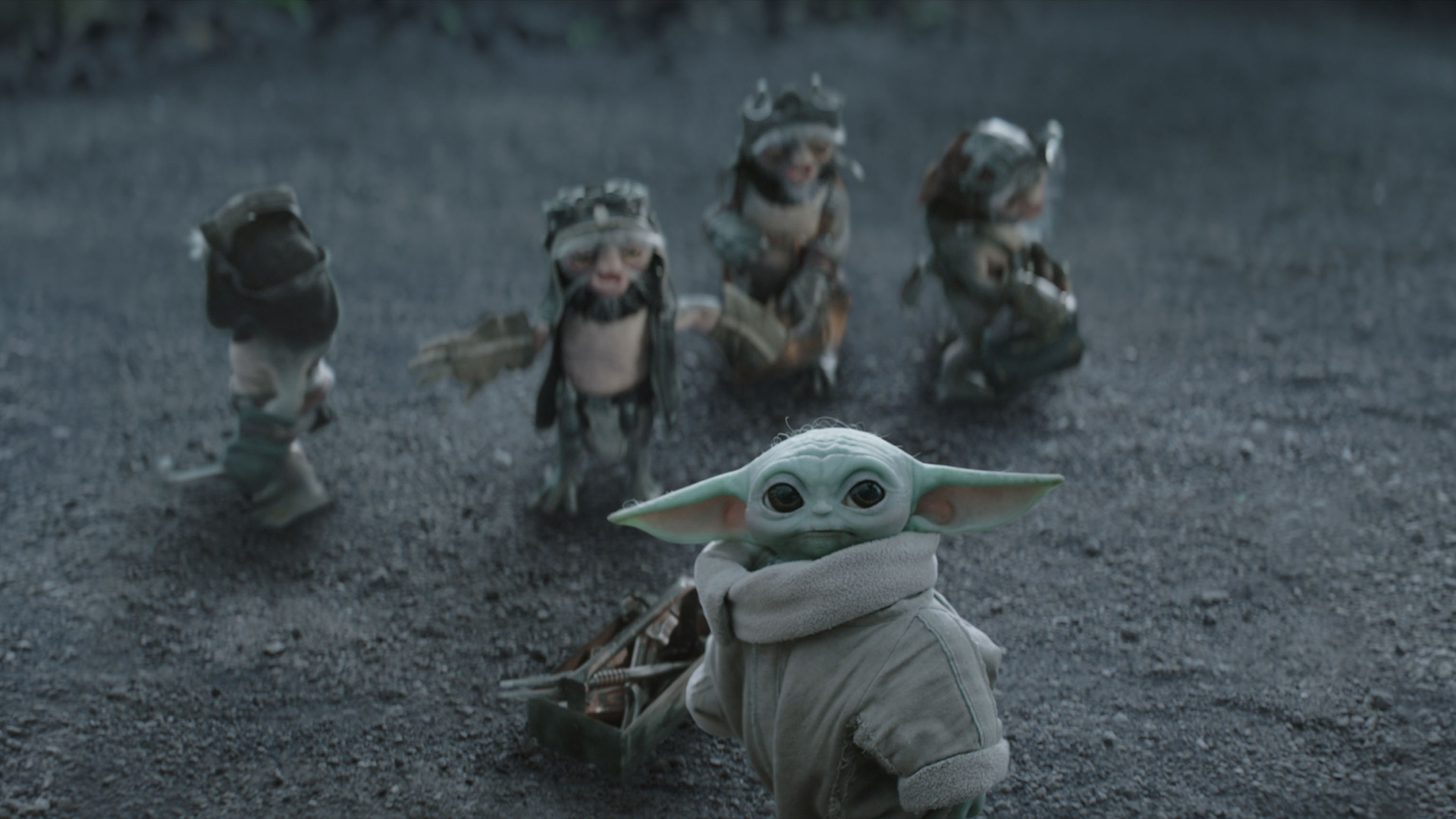 Baby Yoda and Ancellans look up to something in The Mandalorian and Grogu