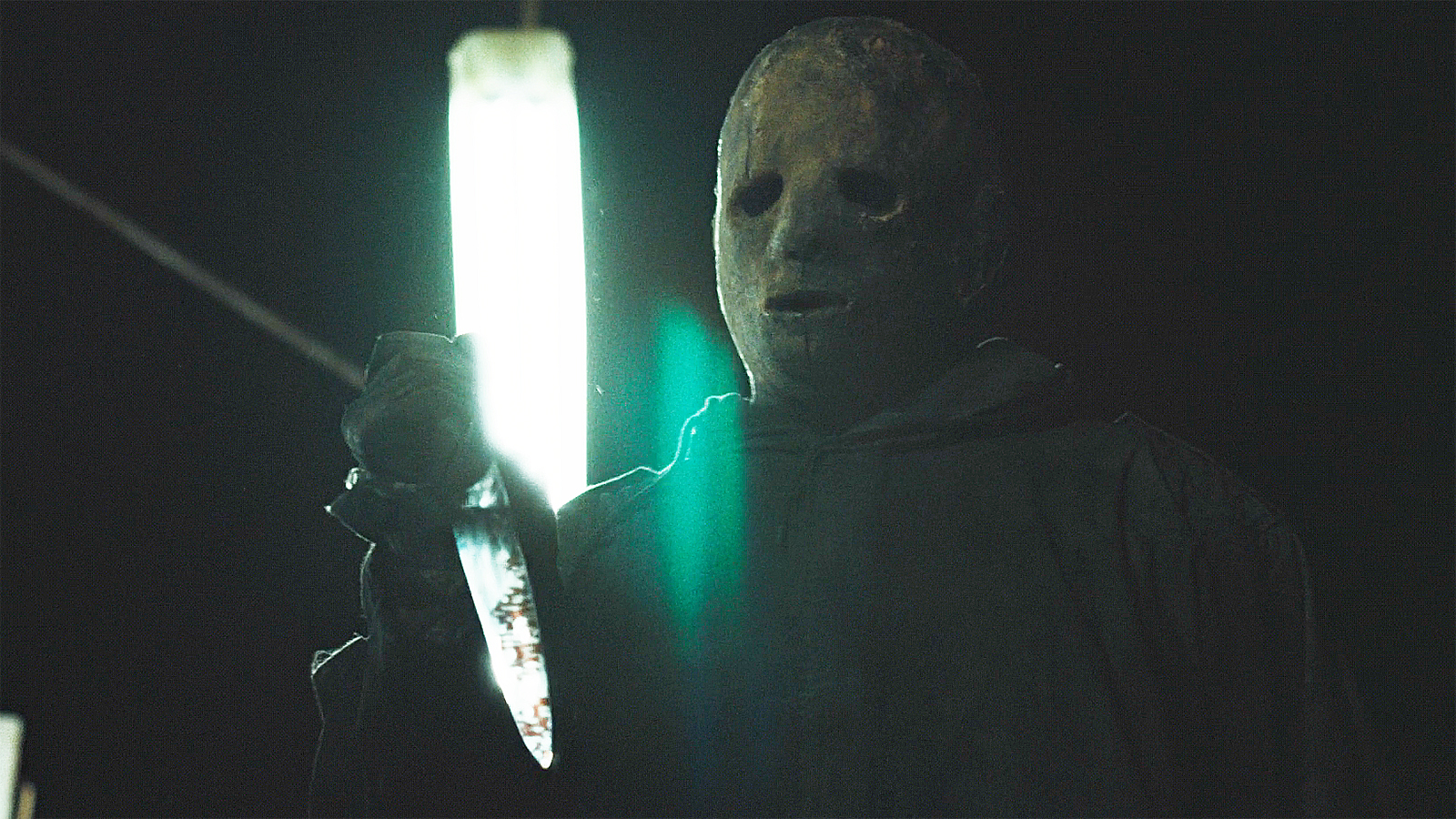 A close-up of The Boogeyman holding a knife at night in Widow's Bay episode 8