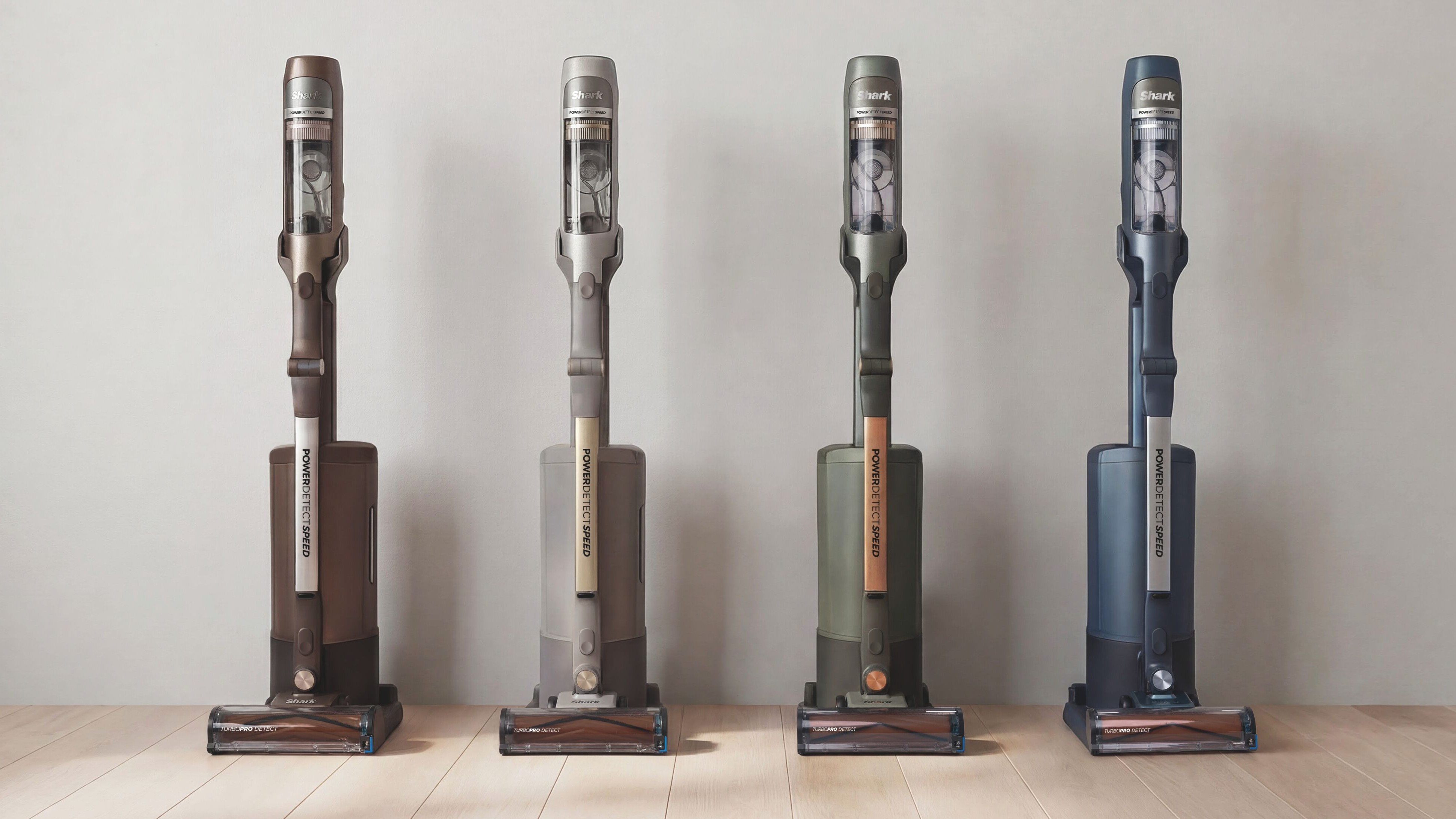 Shark PowerDetect Speed ​​Clean & Empty vacuum cleaner in brown, beige, green and blue lined up along a wall