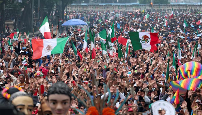 People take part in an attempt to break the Guinness World Record for the world's largest Mexican wave along Reforma Avenue as part of activities ahead of the 2026 Fifa World Cup, in Mexico City, Mexico, June 6, 2026. — Reuters