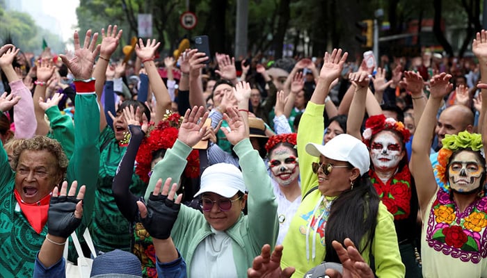 People take part in an attempt to break the Guinness World Record for the world's largest Mexican wave along Reforma Avenue as part of activities ahead of the 2026 Fifa World Cup, in Mexico City, Mexico, June 6, 2026. — Reuters