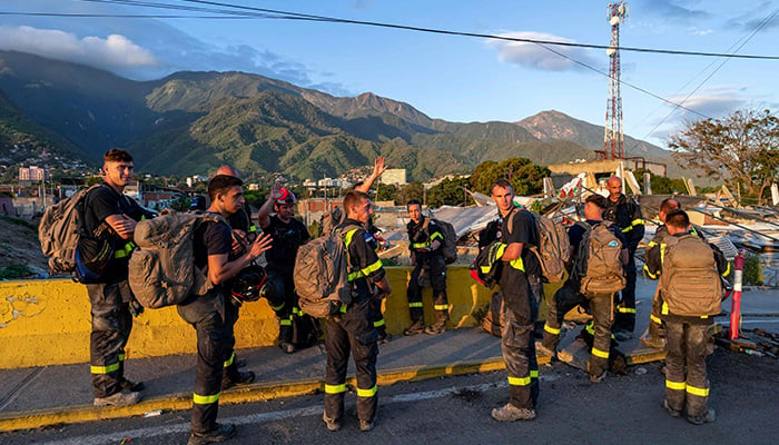 Members of the French Civil Security Training and Intervention Regiment (UIISC 7) attend an area affected by building collapse in the state of La Guaira, Venezuela, on June 28, 2026, after an earthquake. — AFP