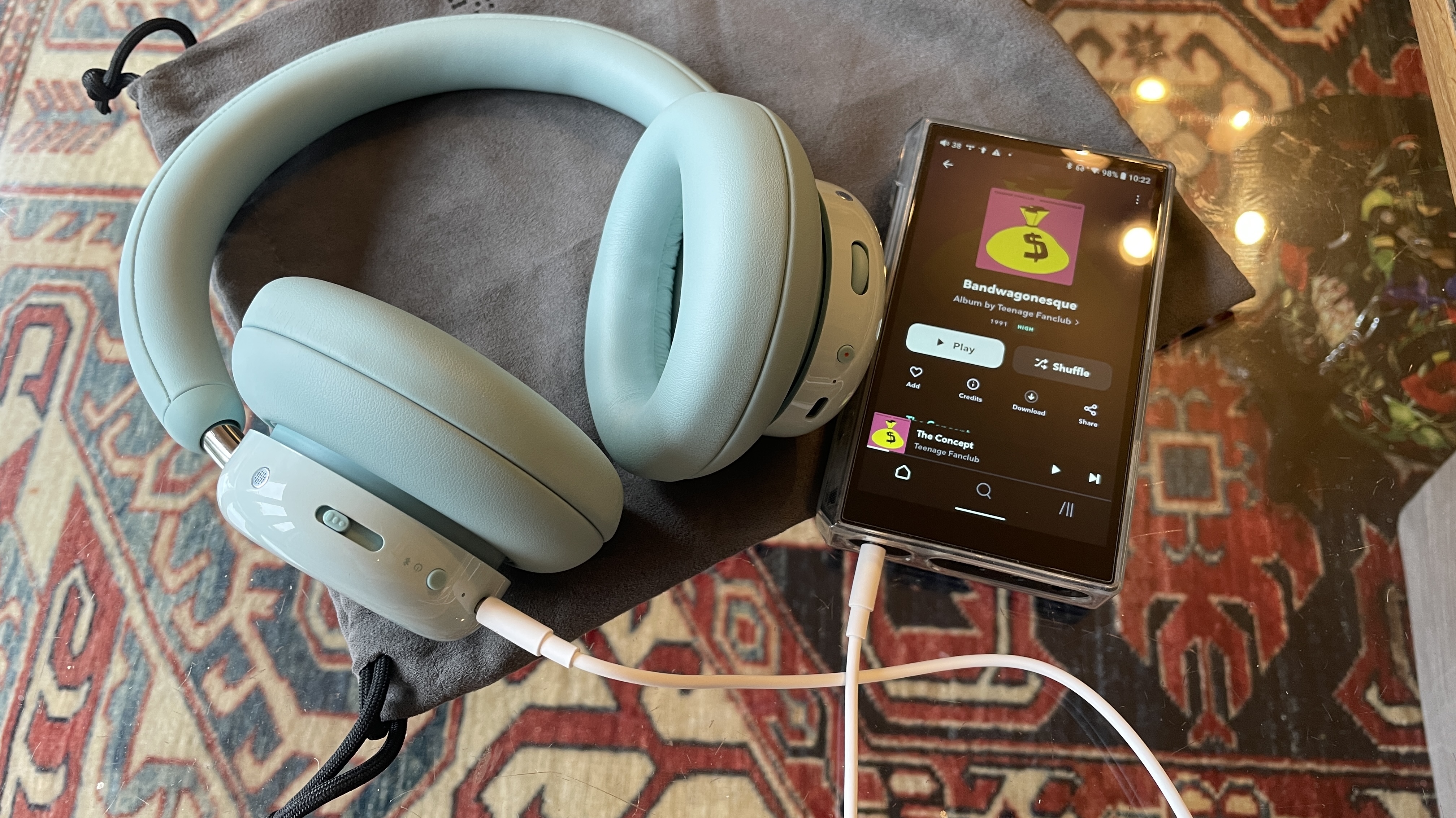 CMF Headphone Pro either next to the Nothing Headphone (1) or on a table with accessories in the box