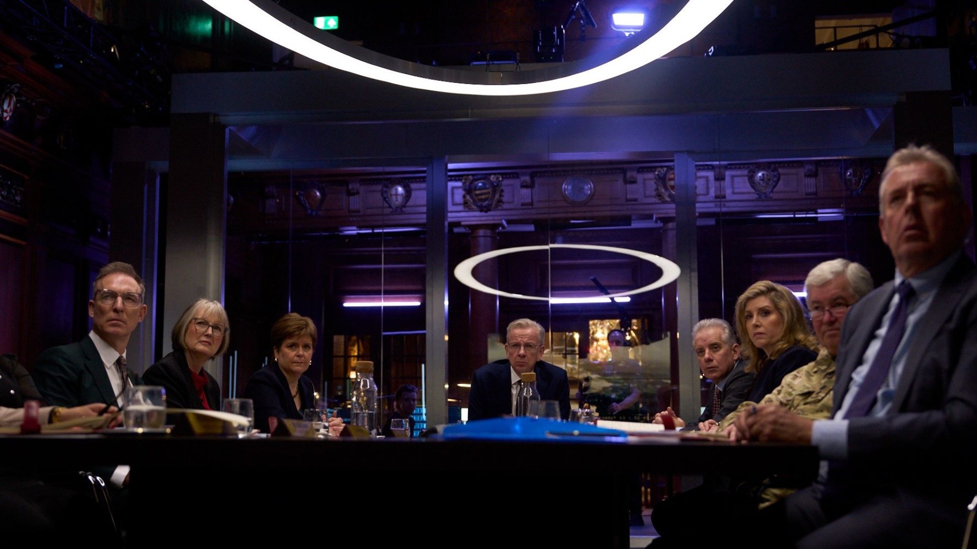 A fake cabinet sits around a board table