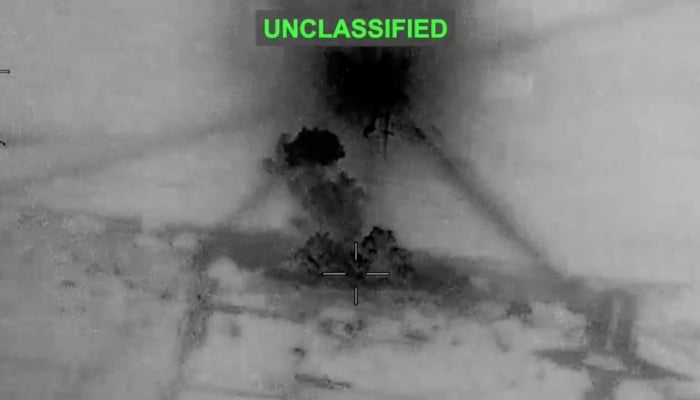 Smoke rises from explosions at an undisclosed location after what US Central Command says was strikes on Iran in response to an Iranian drone attack on a cargo ship in the Strait of Hormuz, in this screenshot from video released June 26, 2026. — Reuters