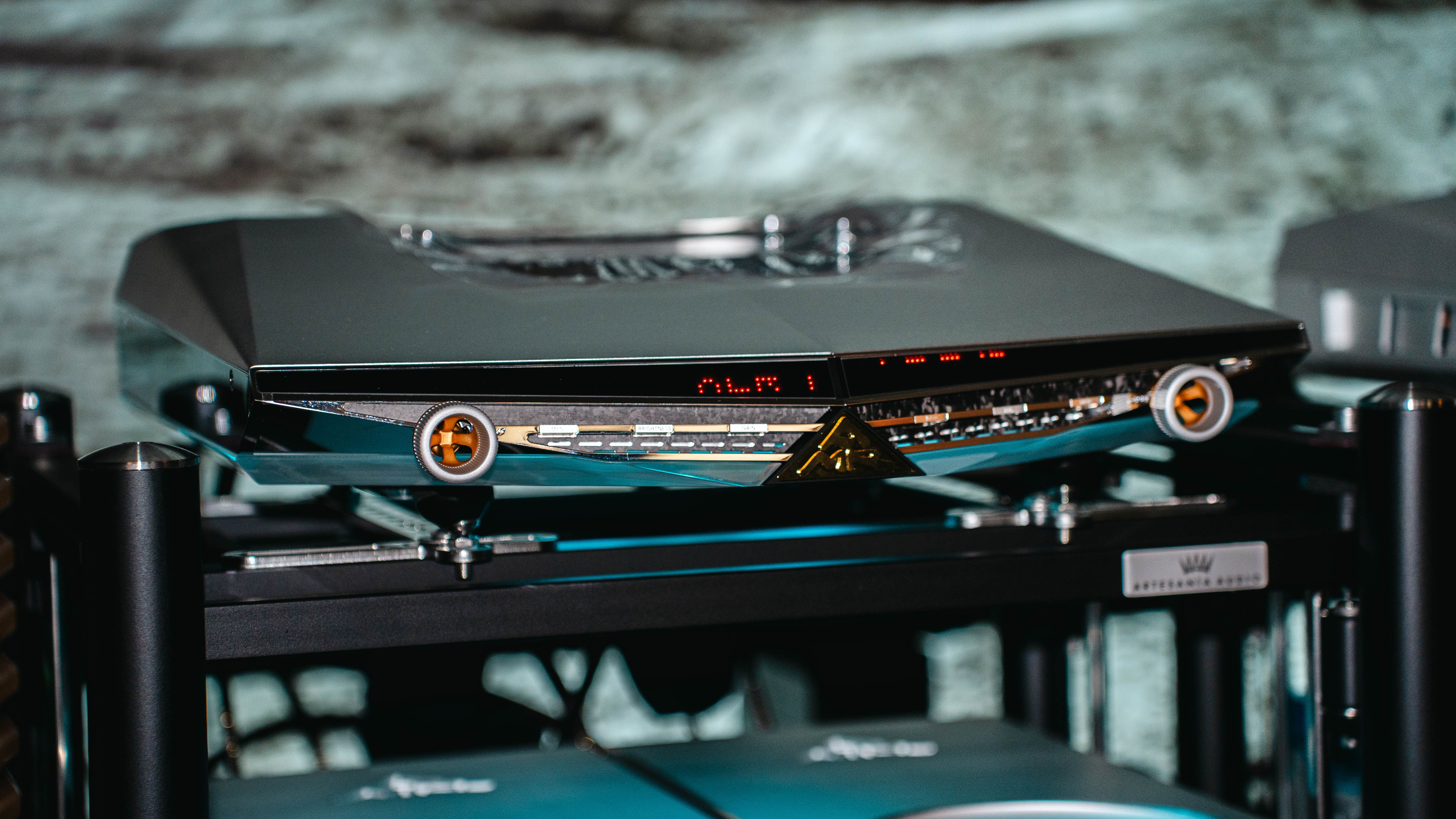 AMR's Luna series separately on a hi-fi stand with gray background