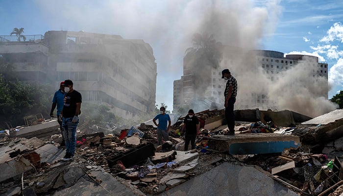 Rescue workers and volunteers search for survivors in La Guaira, La Guaira state, Venezuela, on June 28, 2026, after two earthquakes. — AFP