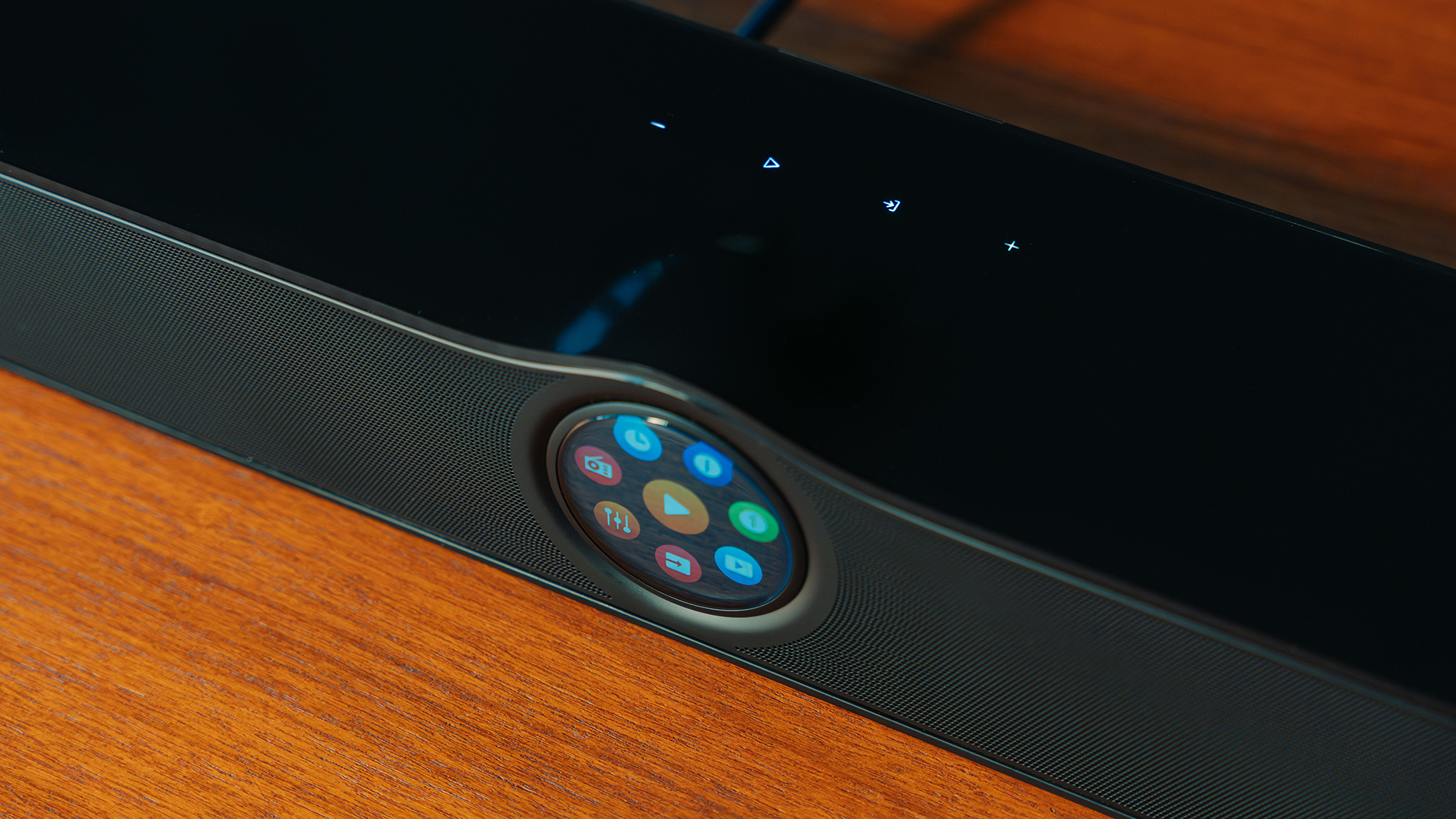 A close-up of the WiiM Bar's screen, also showing touch buttons on its top surface
