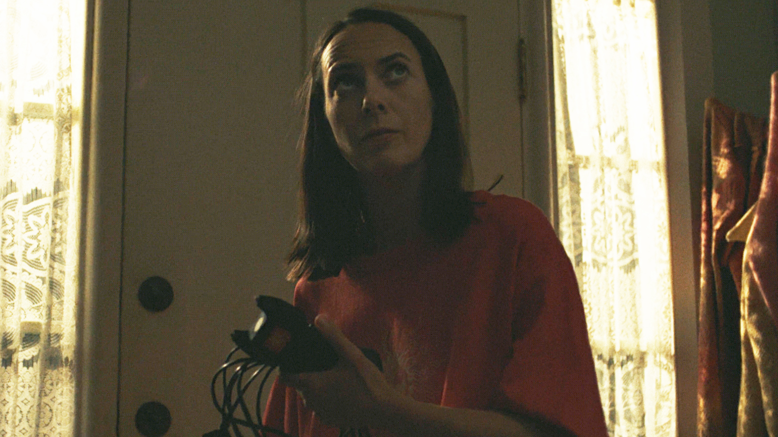 Patricia keeps a tazer and its charging cable in her house at night in Widow's Bay episode 8