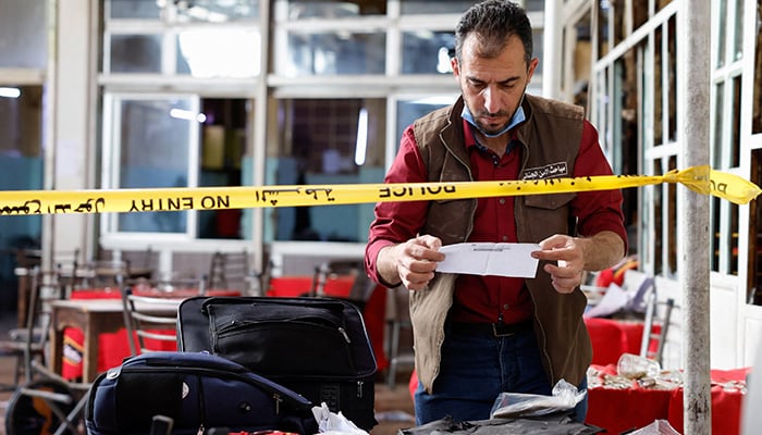 An emergency response member works at the site of what Syrian state media reported was an explosion at a cafe in central Damascus, Syria, July 2, 2026. — Reuters