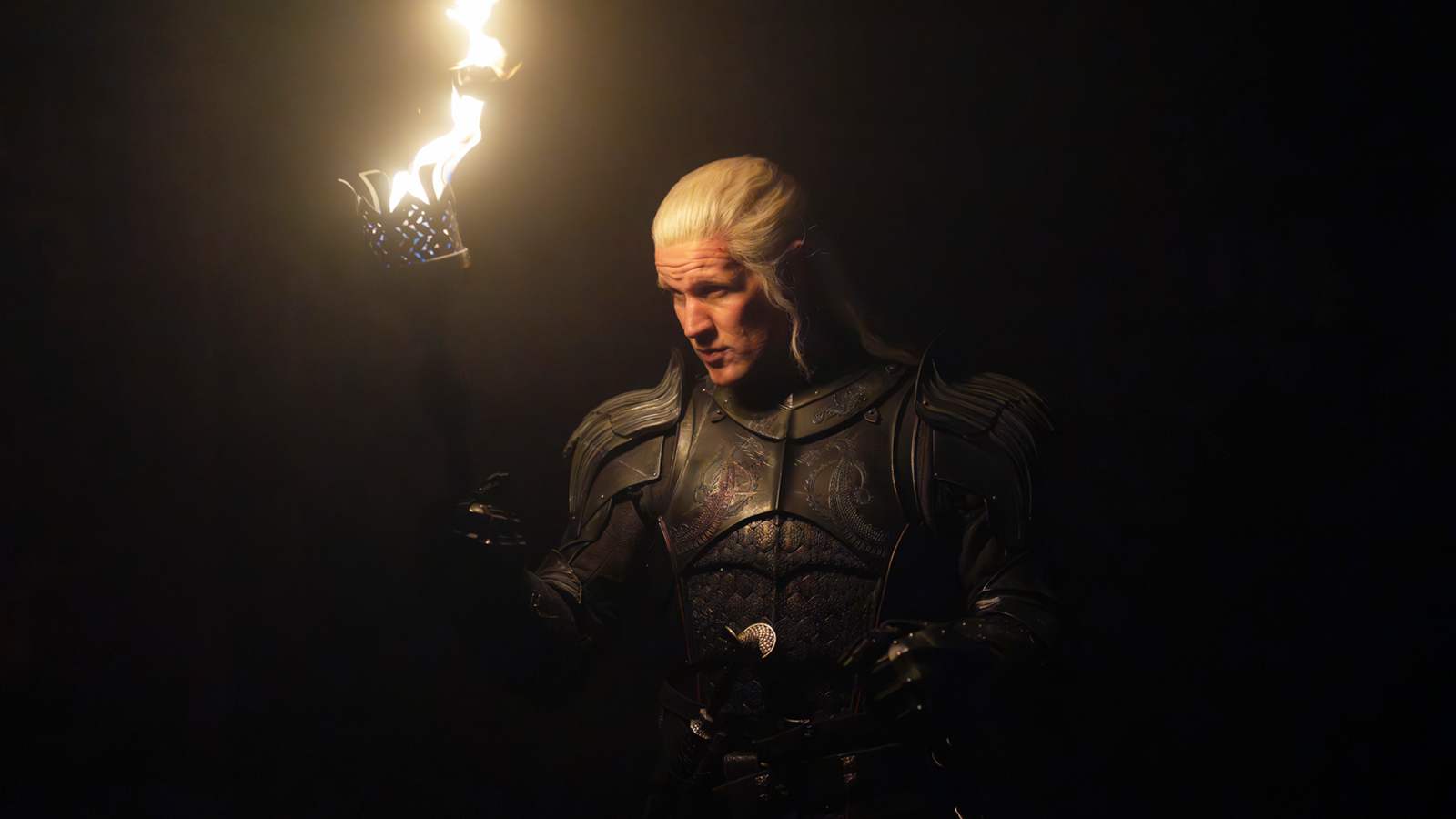 Daemon Targaryen holds a torch in a dark room in House of the Dragon Season 3 Episode 2