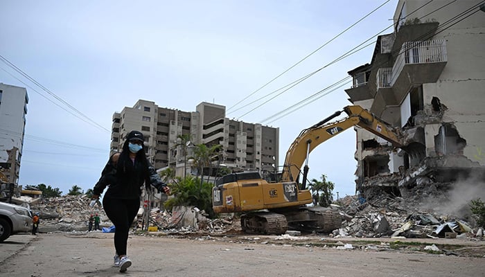 A backhoe demolishes a building in La Guaira, Venezuela on July 4, 2026, following the twin earthquakes of June 24. — AFP