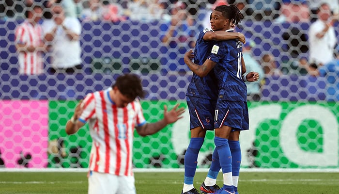 Frances Michael Olise and Kylian Mbappe celebrate after the match. - Reuters