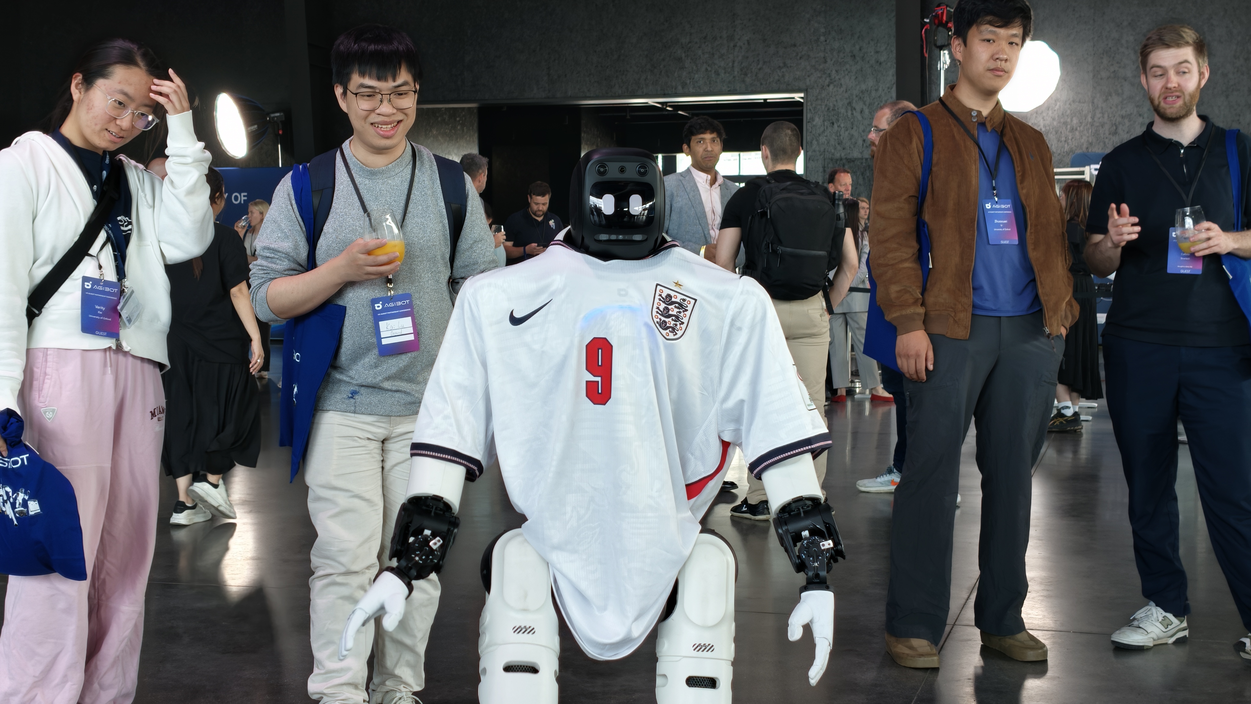 An AGIBOT X2 dressed in a Harry Kane shirt