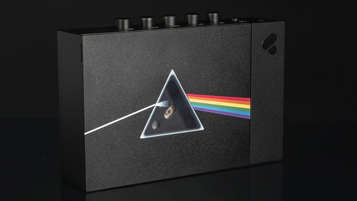 The Pink Floyd x We Are Rewind cassette player features the Dark Side of the Moon album logo on the front with a triangular window where the prism would be