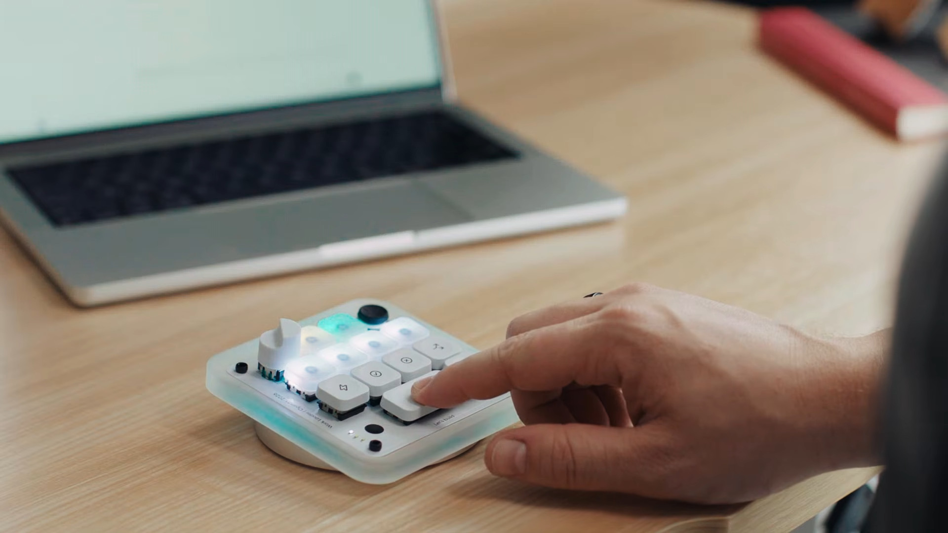 The Codex Micro is used with a person pressing the microphone button