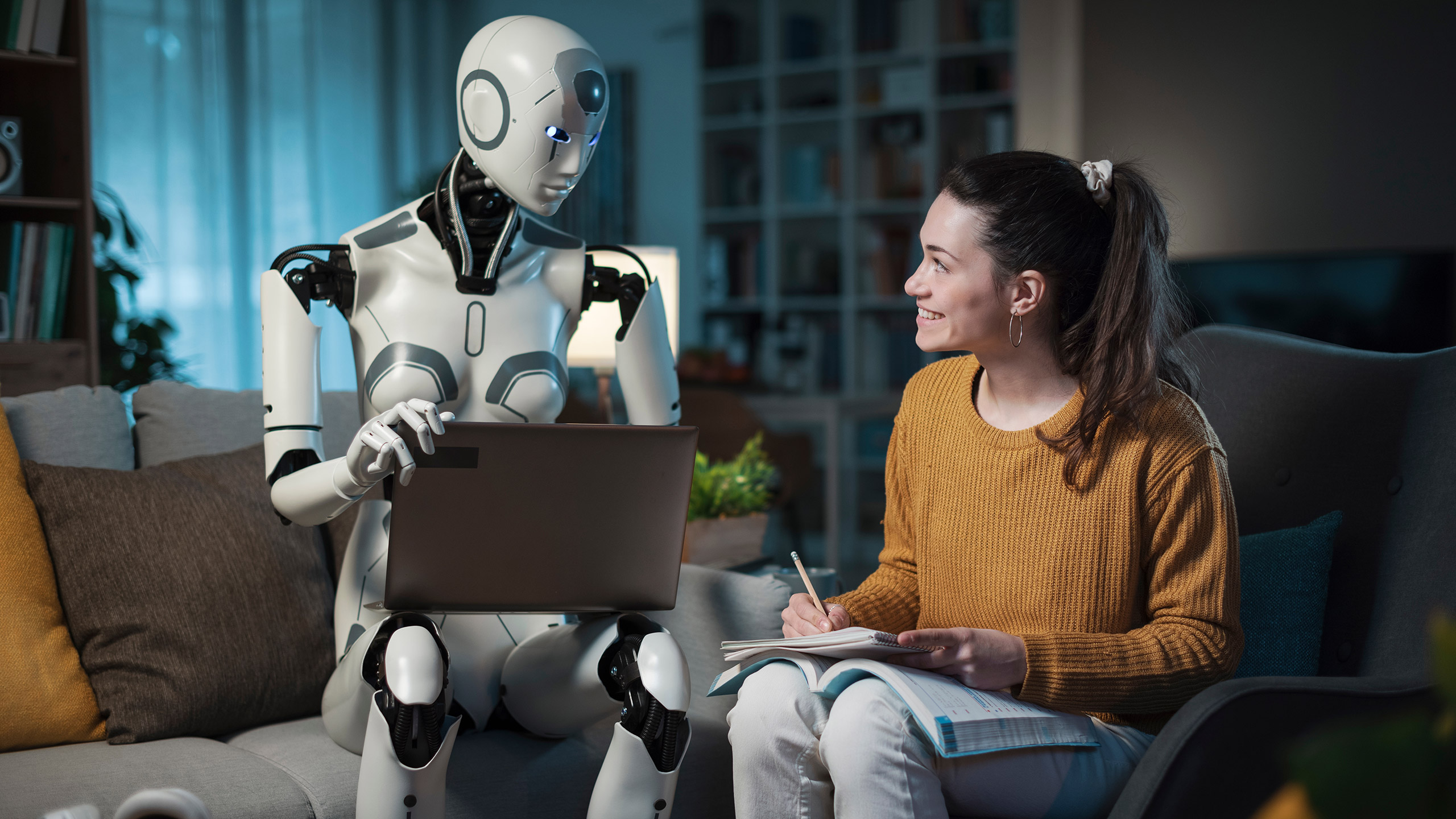 With an AI android by her side, a young woman studies on a sofa in her modern home and extols the benefits of artificial intelligence.