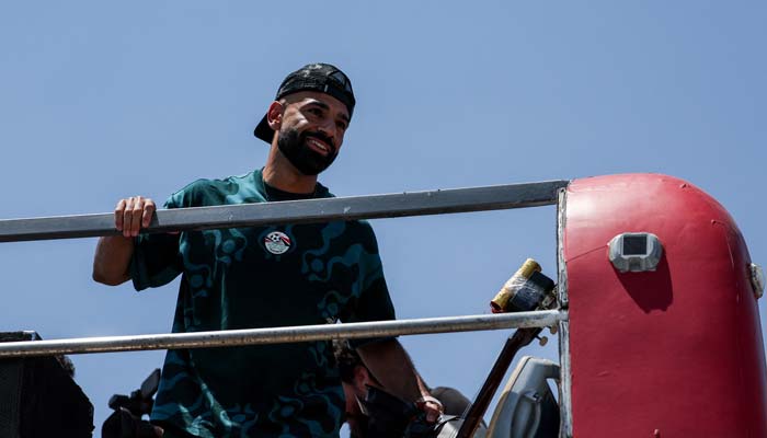 Egypt's Mohamed Salah looks on at the crowd from a bus as the Egyptian national team is welcomed by fans at El Alamein International Airport as it returns from the 2026 FIFA World Cup, ahead of an official reception by President Abdel Fattah al-Sisi, in El Dabaa, Egypt, July 10, 2026. — Reuters