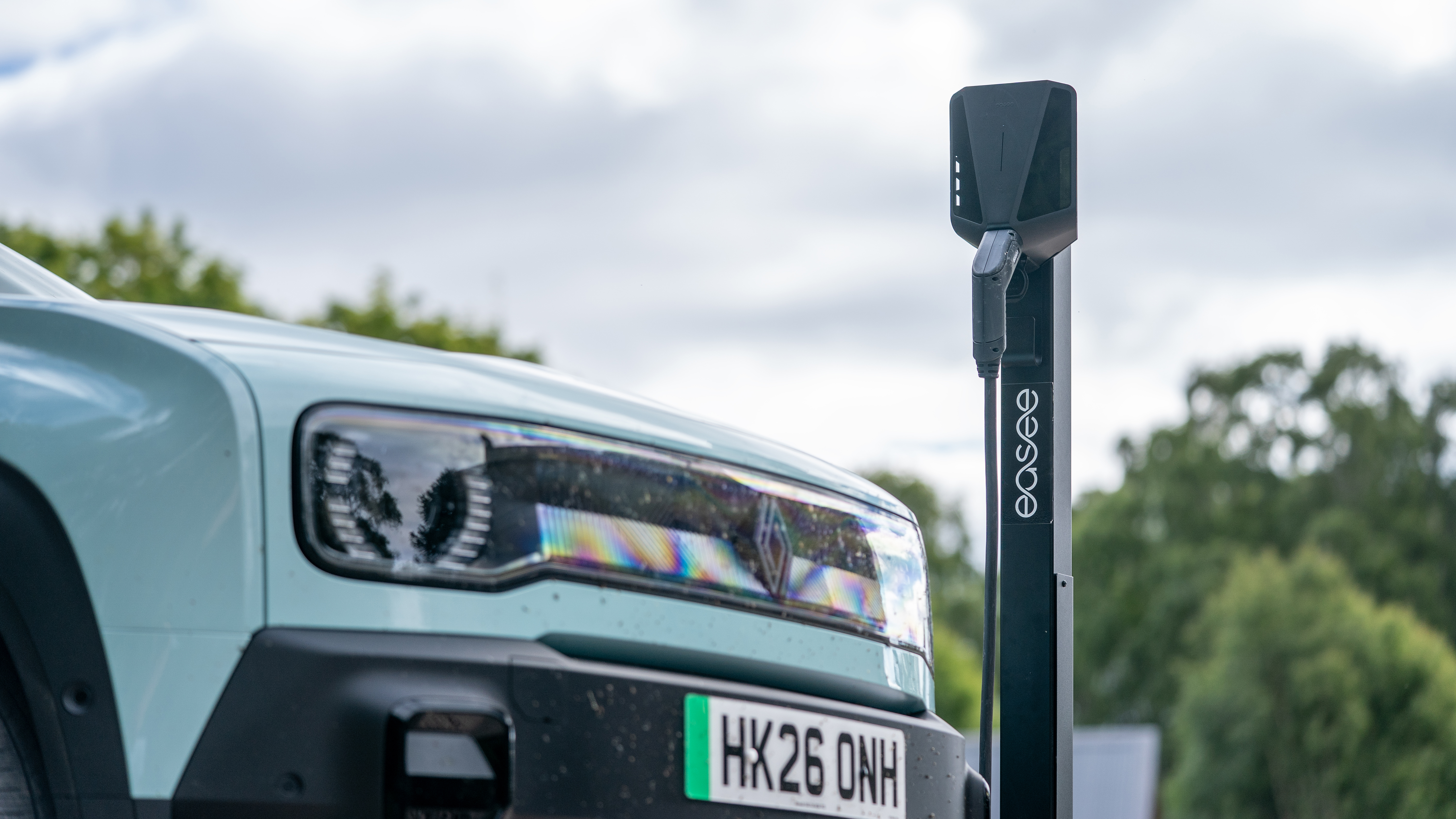 An electric car next to a charging station