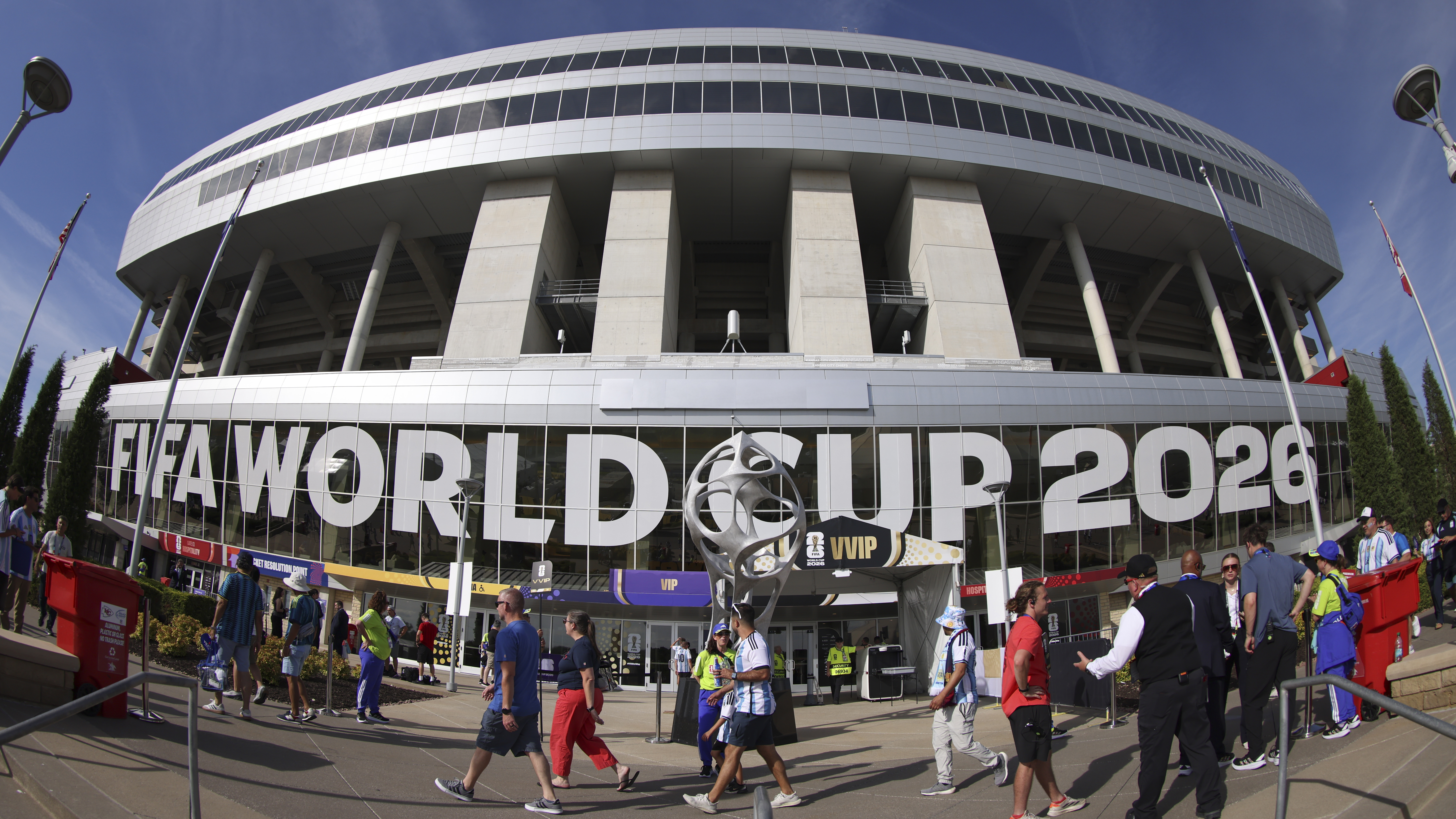 The exterior of a World Cup 2026 stadium with people walking by