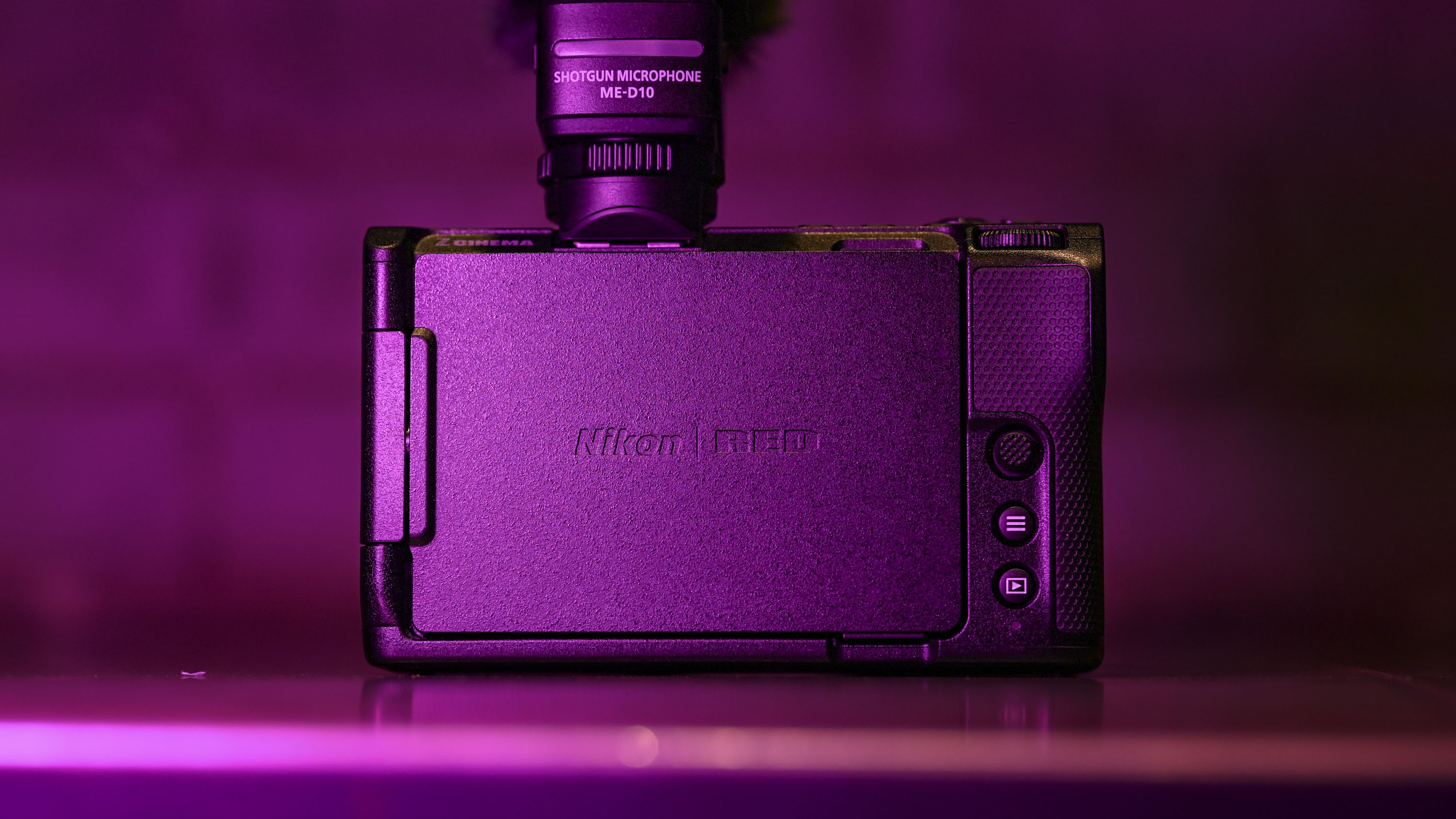 The back of the Nikon ZR camera under low-key magenta lighting